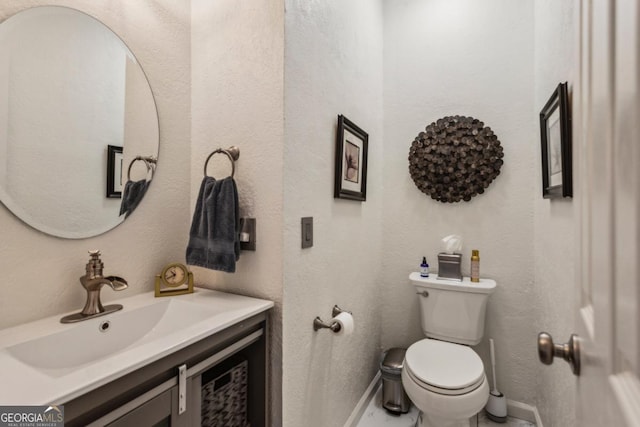 107 W Point Trl, Woodstock, GA 30189 - bathroom with vanity, baseboards, and toilet