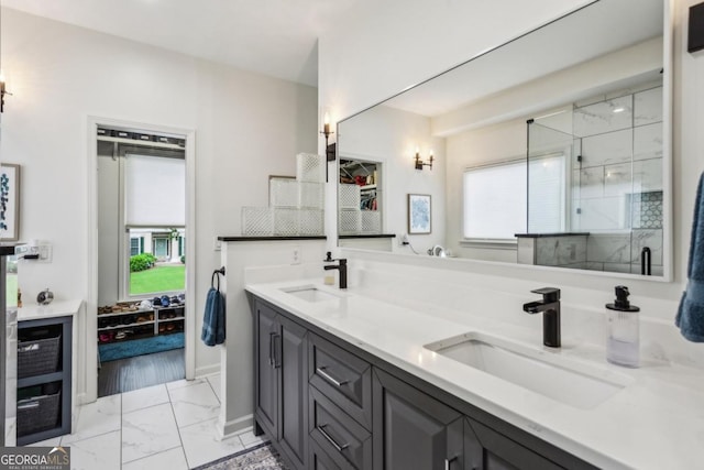 107 W Point Trl, Woodstock, GA 30189 - bathroom featuring marble finish floors, double vanity, a stall shower, and baseboards