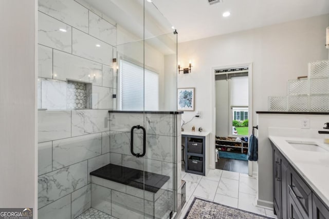 107 W Point Trl, Woodstock, GA 30189 - bathroom featuring marble finish floors, vanity, a stall shower, and recessed lighting