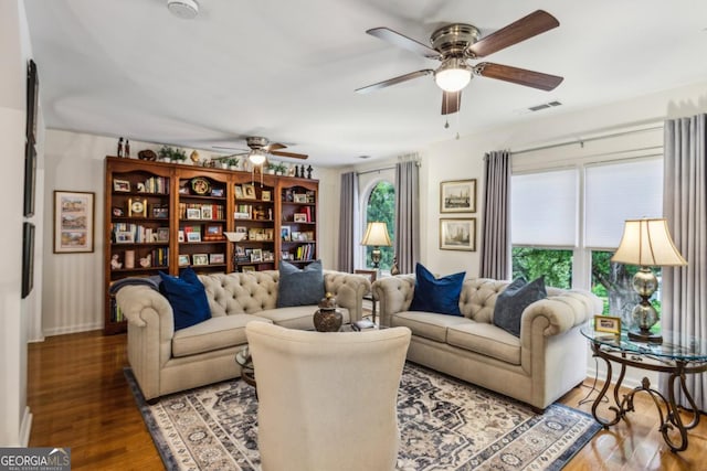107 W Point Trl, Woodstock, GA 30189 - living area with a ceiling fan, wood finished floors, and baseboards
