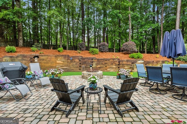 107 W Point Trl, Woodstock, GA 30189 - view of patio / terrace with an outdoor fire pit, outdoor dining space, and view of scattered trees