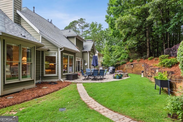107 W Point Trl, Woodstock, GA 30189 - view of green lawn with a patio