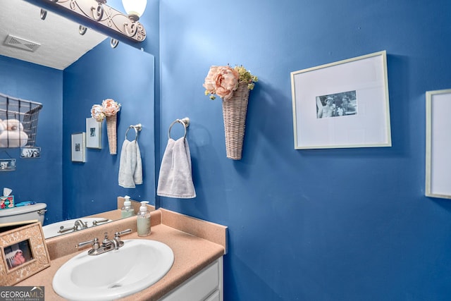 81 Maple Creek Dr, Newnan, GA 30263 - bathroom featuring vanity and toilet