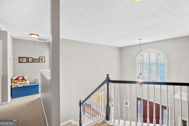 81 Maple Creek Dr, Newnan, GA 30263 - staircase with a textured ceiling, baseboards, and carpet floors