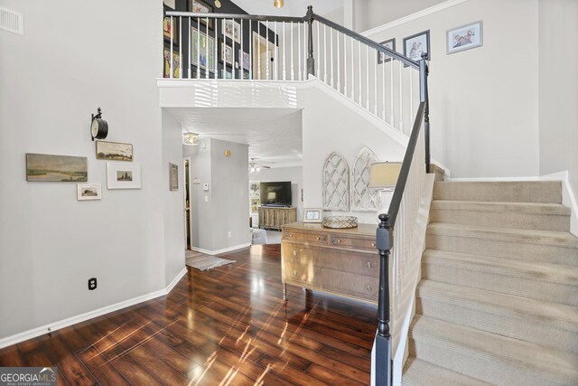 81 Maple Creek Dr, Newnan, GA 30263 - staircase with baseboards, wood finished floors, ceiling fan, and a high ceiling