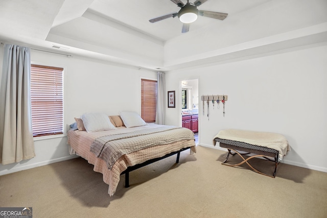 81 Maple Creek Dr, Newnan, GA 30263 - bedroom featuring a tray ceiling, light colored carpet, baseboards, and a ceiling fan