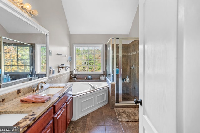 81 Maple Creek Dr, Newnan, GA 30263 - full bathroom with a garden tub, lofted ceiling, a shower stall, double vanity, and tile patterned flooring