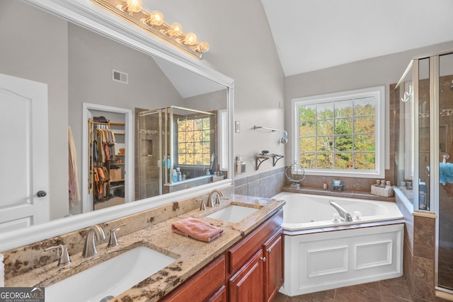 81 Maple Creek Dr, Newnan, GA 30263 - full bath featuring a shower stall, a jetted tub, double vanity, a spacious closet, and high vaulted ceiling