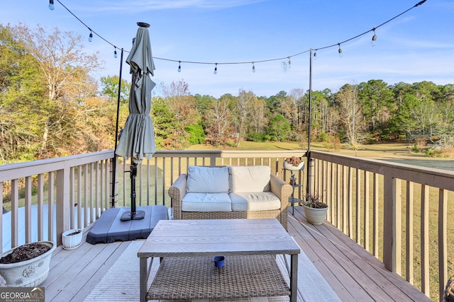 81 Maple Creek Dr, Newnan, GA 30263 - wooden terrace with an outdoor living space and a view of trees