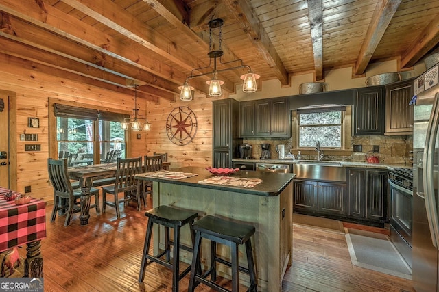 1061 Fir Ln, Ellijay, GA 30540 - kitchen featuring a sink, healthy amount of natural light, wood walls, wood-type flooring, and wood ceiling with exposed beams