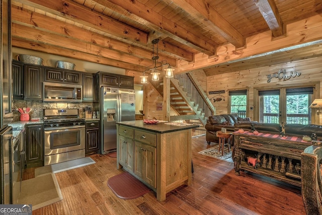 1061 Fir Ln, Ellijay, GA 30540 - kitchen with appliances with stainless steel finishes, wood ceiling with exposed beams, open floor plan, dark countertops, and dark wood-type flooring