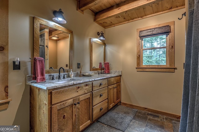 1061 Fir Ln, Ellijay, GA 30540 - bathroom featuring double vanity, wood ceiling with exposed beams, baseboards, and stone finish floors