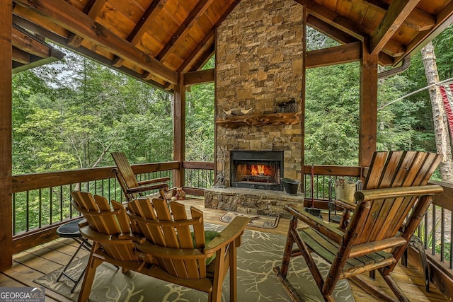 1061 Fir Ln, Ellijay, GA 30540 - deck with an outdoor stone fireplace and a wooded view