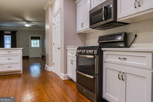 15 Westover Dr SW, Rome, GA 30165 - kitchen featuring double oven range, stainless steel microwave, ornamental molding, a ceiling fan, and wood-type flooring