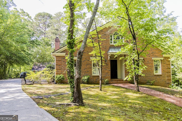 15 Westover Dr SW, Rome, GA 30165 - view of front of home with a chimney, brick siding, and a front lawn