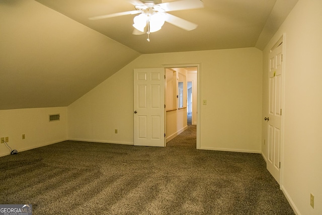 15 Westover Dr SW, Rome, GA 30165 - additional living space with ceiling fan, dark colored carpet, lofted ceiling, and baseboards