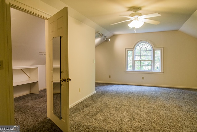 15 Westover Dr SW, Rome, GA 30165 - spare room featuring dark colored carpet, ceiling fan, lofted ceiling, and baseboards