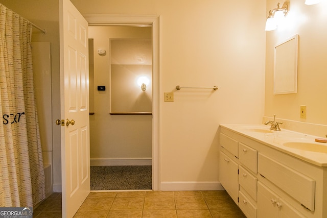 15 Westover Dr SW, Rome, GA 30165 - full bath featuring tile patterned floors, double vanity, and baseboards