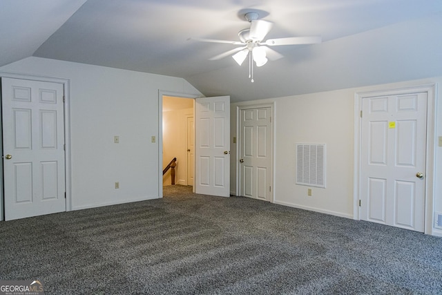 15 Westover Dr SW, Rome, GA 30165 - unfurnished bedroom with lofted ceiling, dark colored carpet, baseboards, and ceiling fan