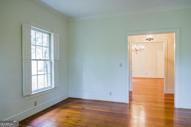 15 Westover Dr SW, Rome, GA 30165 - empty room with a chandelier, wood finished floors, ornamental molding, and baseboards
