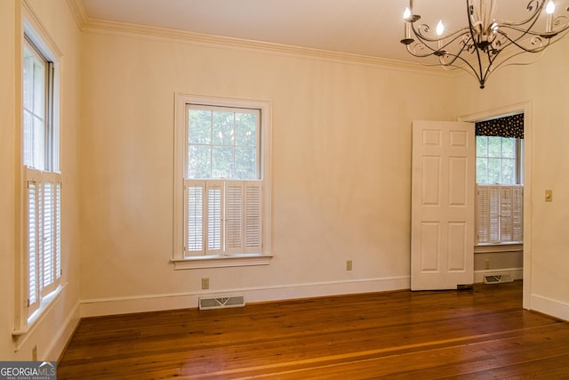 15 Westover Dr SW, Rome, GA 30165 - spare room featuring a chandelier, ornamental molding, dark wood-style flooring, and baseboards