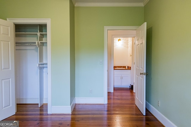 15 Westover Dr SW, Rome, GA 30165 - unfurnished bedroom with ornamental molding, wood finished floors, a closet, and baseboards