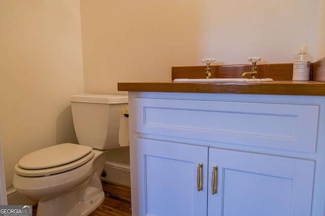 15 Westover Dr SW, Rome, GA 30165 - half bathroom with toilet, vanity, and wood finished floors