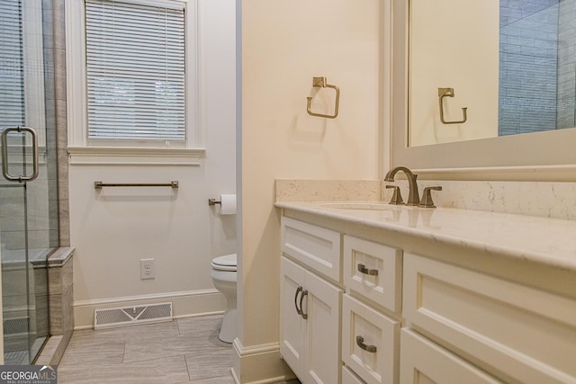 15 Westover Dr SW, Rome, GA 30165 - full bath with toilet, vanity, a stall shower, and baseboards