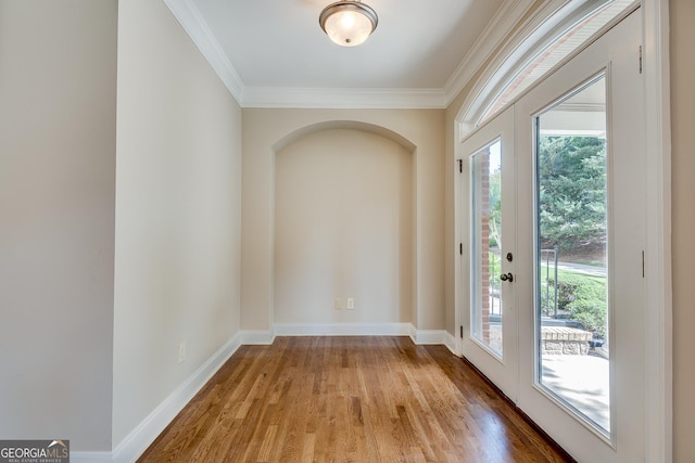 3641 Ridge Towne Dr, Duluth, GA 30096 - empty room with wood finished floors, ornamental molding, and plenty of natural light