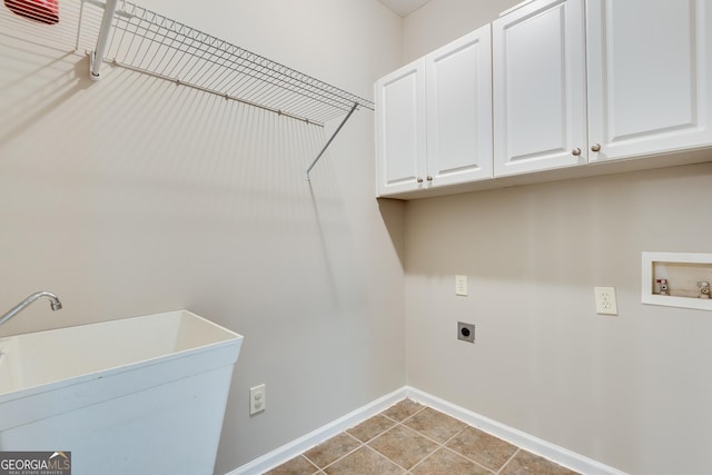 3641 Ridge Towne Dr, Duluth, GA 30096 - laundry area with electric dryer hookup, cabinet space, hookup for a washing machine, and light tile patterned floors
