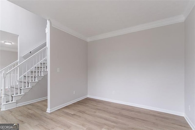 1706 Brandon Lee Way, Marietta, GA 30008 - unfurnished room with crown molding, light wood-style flooring, baseboards, and stairs