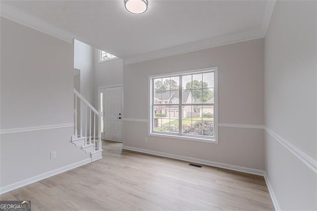 1706 Brandon Lee Way, Marietta, GA 30008 - empty room featuring crown molding, wood finished floors, stairway, and baseboards