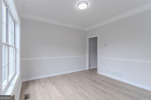 1706 Brandon Lee Way, Marietta, GA 30008 - empty room featuring light wood-type flooring, ornamental molding, and baseboards