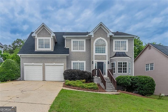 1706 Brandon Lee Way, Marietta, GA 30008 - view of front of home featuring concrete driveway, a front lawn, stucco siding, and a garage