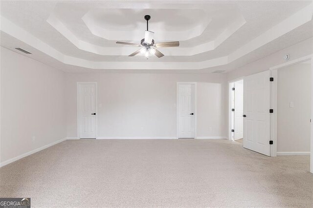 1706 Brandon Lee Way, Marietta, GA 30008 - unfurnished room with a tray ceiling, light colored carpet, ceiling fan, and baseboards