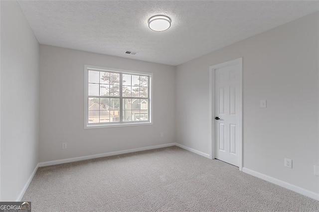1706 Brandon Lee Way, Marietta, GA 30008 - spare room with carpet floors, a textured ceiling, and baseboards