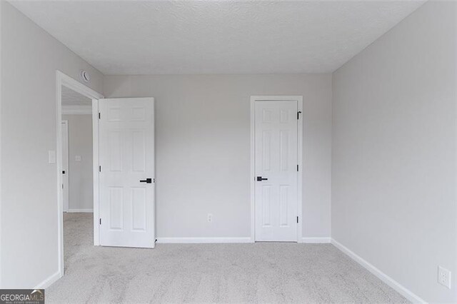 1706 Brandon Lee Way, Marietta, GA 30008 - unfurnished bedroom with carpet floors and baseboards