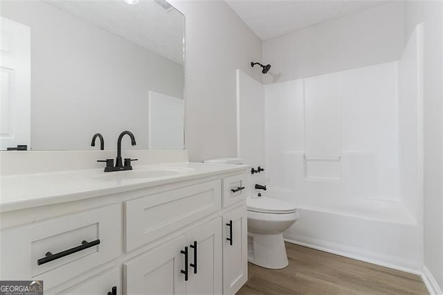 1706 Brandon Lee Way, Marietta, GA 30008 - bathroom featuring toilet, vanity, bathing tub / shower combination, and wood finished floors