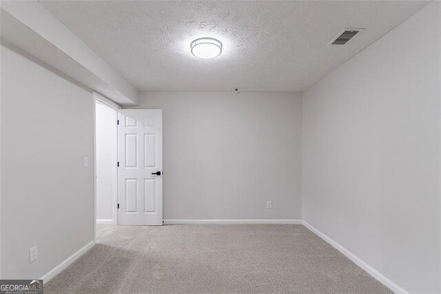 1706 Brandon Lee Way, Marietta, GA 30008 - carpeted spare room with a textured ceiling and baseboards