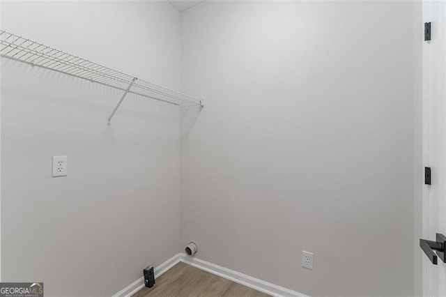 1706 Brandon Lee Way, Marietta, GA 30008 - laundry area with light wood-style flooring and baseboards