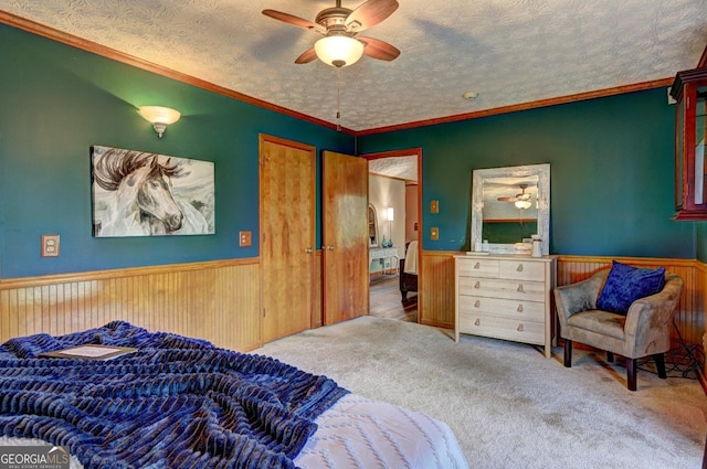3452 Monica Ln SW, Conyers, GA 30094 - bedroom with wainscoting, carpet, a textured ceiling, wood walls, and crown molding