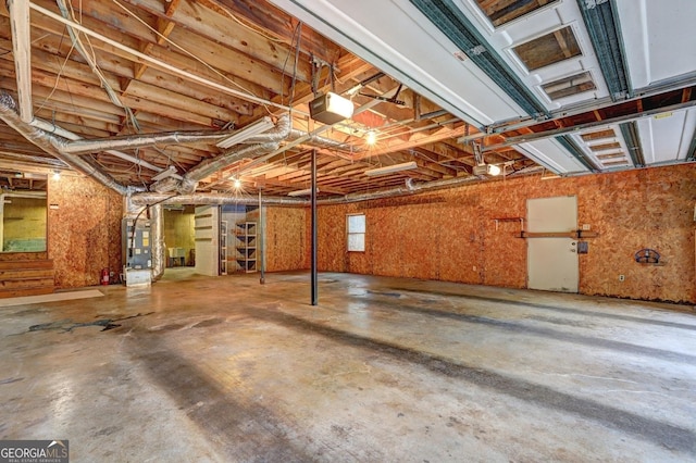 3452 Monica Ln SW, Conyers, GA 30094 - garage featuring a garage door opener and heating unit