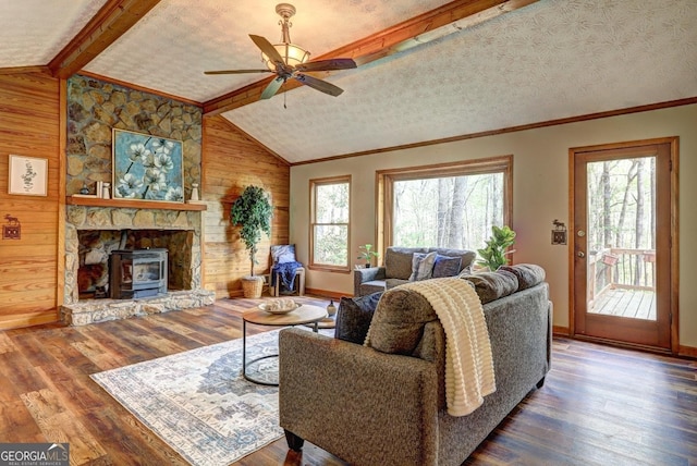 3452 Monica Ln SW, Conyers, GA 30094 - living area featuring plenty of natural light, wooden walls, baseboards, wood finished floors, and ceiling fan