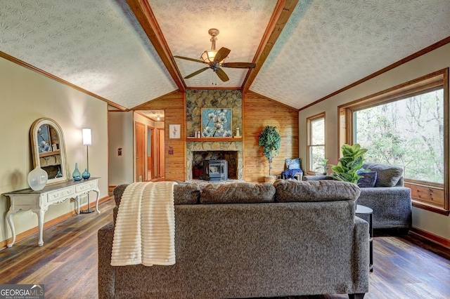 3452 Monica Ln SW, Conyers, GA 30094 - living area featuring crown molding, baseboards, dark wood-style flooring, a ceiling fan, and a textured ceiling