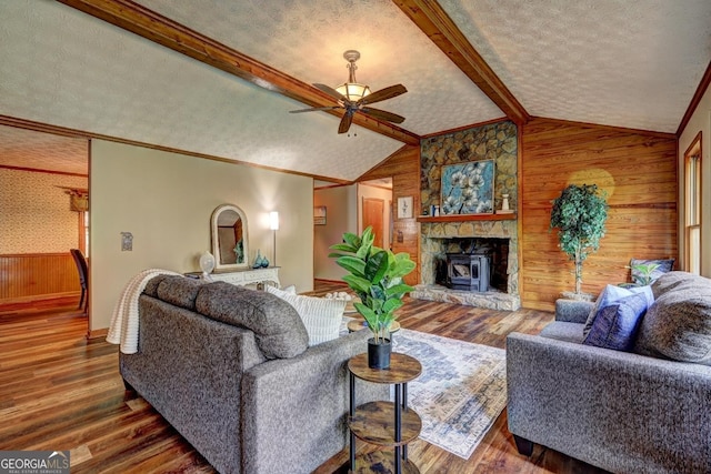 3452 Monica Ln SW, Conyers, GA 30094 - living room featuring wooden walls, a ceiling fan, wood finished floors, baseboards, and a textured ceiling