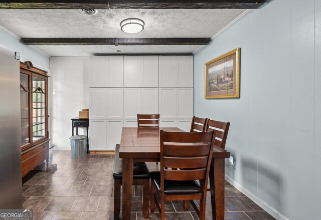 1 Donley Dr NW, Rome, GA 30165 - dining room featuring beamed ceiling, a textured ceiling, and baseboards