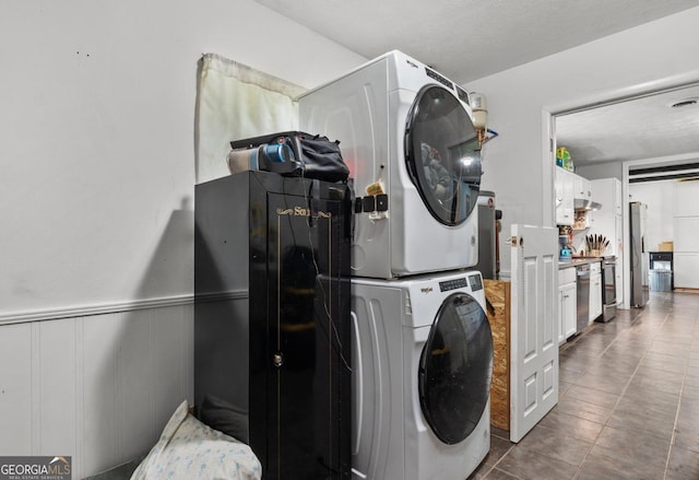 1 Donley Dr NW, Rome, GA 30165 - washroom featuring estacked washer and dryer and wainscoting
