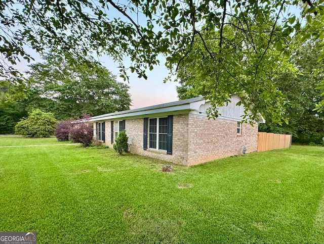 1 Donley Dr NW, Rome, GA 30165 - property exterior at dusk featuring brick siding and a yard