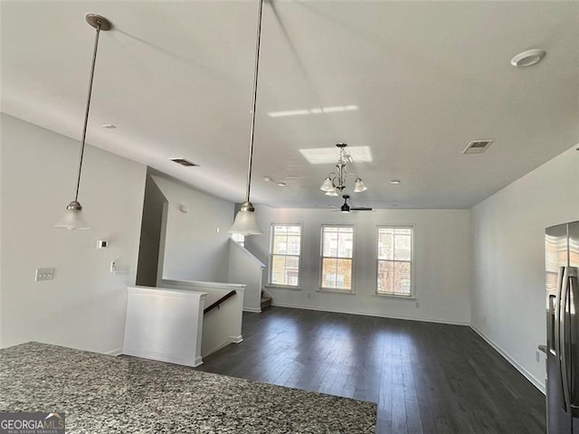 3677 Hidden Valley Cir, Lawrenceville, GA 30044 - unfurnished living room featuring dark wood-style floors, baseboards, and stairs