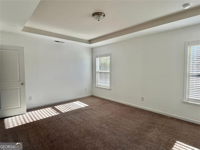 3677 Hidden Valley Cir, Lawrenceville, GA 30044 - carpeted spare room with a smoke detector, a tray ceiling, and baseboards